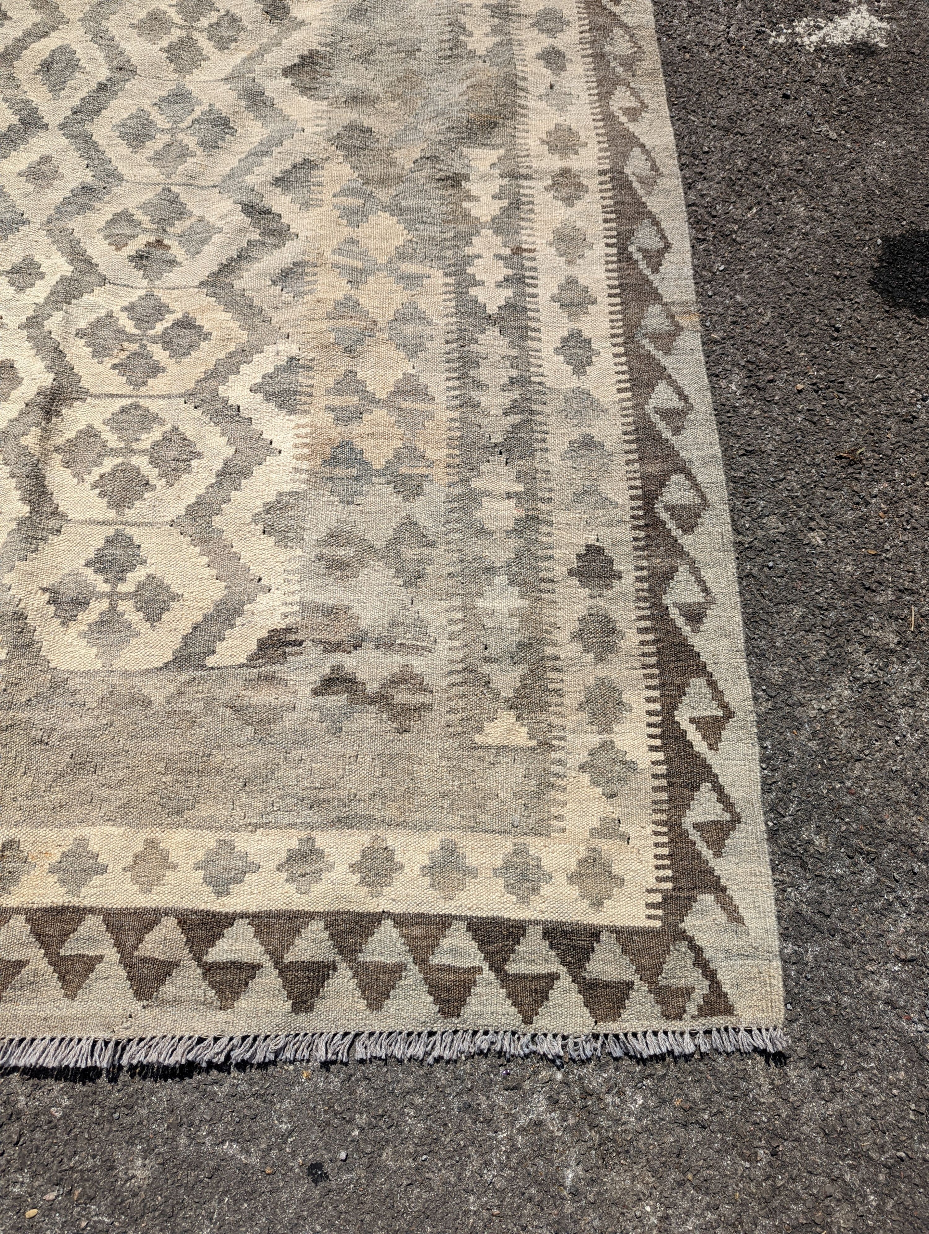 An Anatolian monochrome geometric flatweave carpet, 230 x 175cm